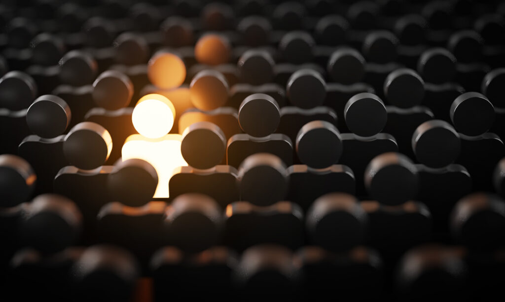 glowing person in a a crowd that is standing out from the rest