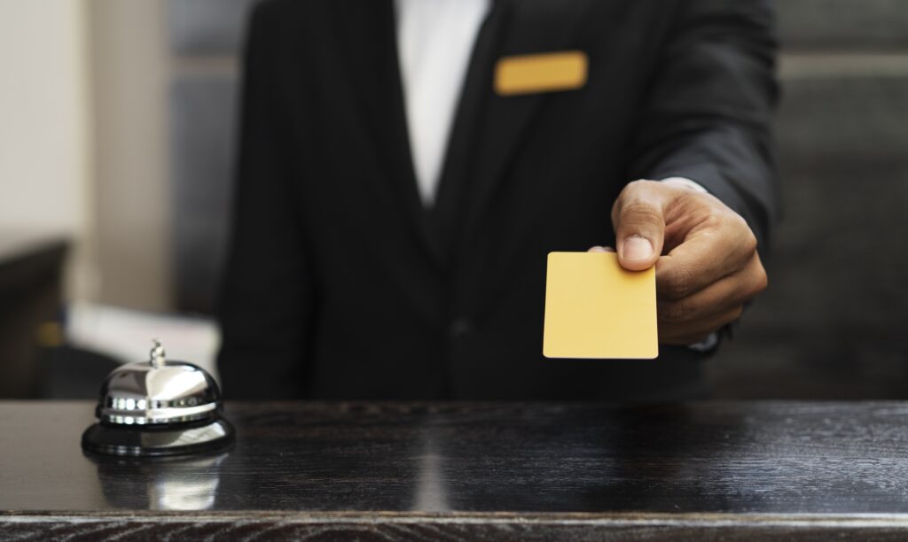 check in at hotel, receptionist handing room key